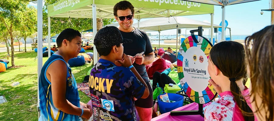 Royal Life Saving staff engaging with youth to teach water safety messages