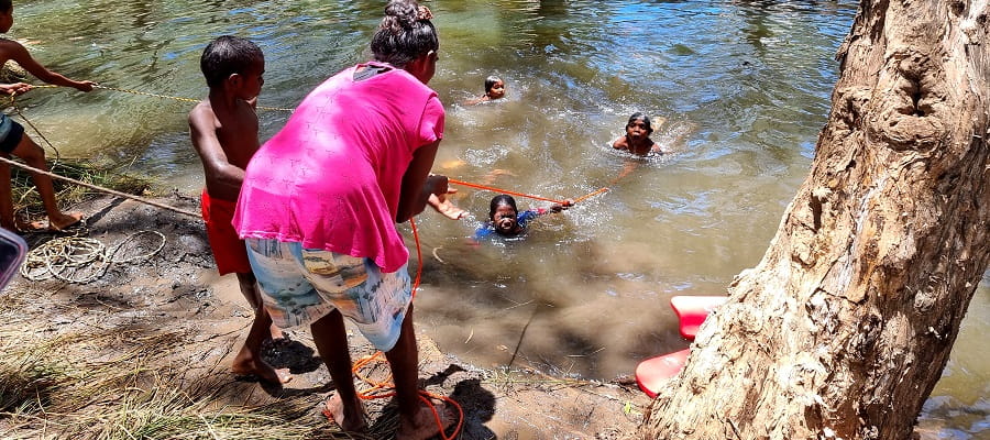 group practising rope throw rescues at a remote creek in WA