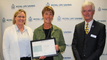 Nicole Durrant receiving her award from Beyond Bank's Georgie Nicholas and RLSSWA President Colin Hassell