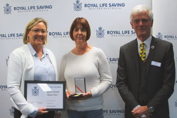 Lesley Ayers receiving her award from Beyond Bank's Georgie Nicholas and RLSSWA President Colin Hassell