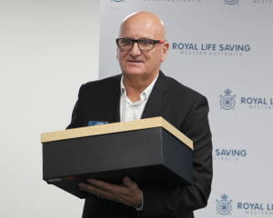 Retiring board member Mark Gubanyi with his gift at the 2020 AGM