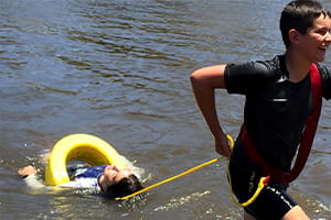 River Ready participant attempting river rescue using tube