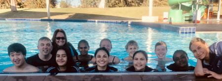 A group of AUSTSWIM course participants in the pool at Port Hedland