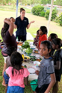 Amy from Boab Health talking to Bidyadanga children