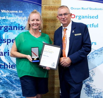 Melissa Gray receiving her award from Mark Folkard, MLA for Burns Beach and Royal Life Saving Swim and Survive Ambassador