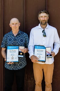 Nick and Dilan holding their awards