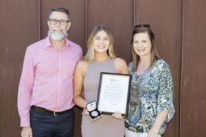 Megan Larmour with her parents at the Bravery Awards