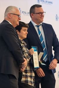 Boy receiving Royal Life Saving Bravery Award