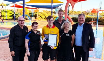 Goldfields Oasis staff and Local Government members with Bravery Award winner James Gent outside the pool at Goldfields Oasis