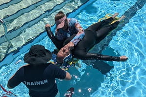 Trainer Leanne Coverley-Brandis supervising a practise spinal board rescue