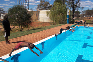 Aboriginal kids diving into the Burringurrah swimming pool