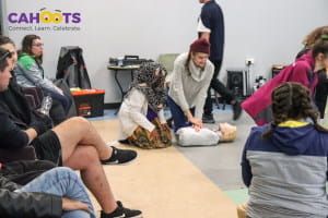 Cahoots participants practising CPR
