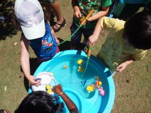 Children enjoying the water play table at our Children's Week stall