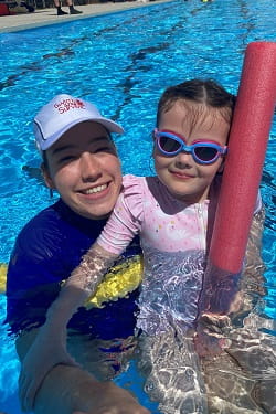 Lozswim swimming instructor with student in the pool