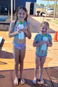 Two girls wearing bathers at Exmouth Pool