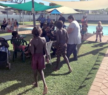 Community members gathering at Fitzroy Crossing Pool for an awards event