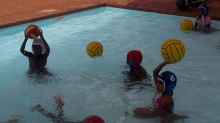 Children learning Flippa Ball at Yandeyarra pool