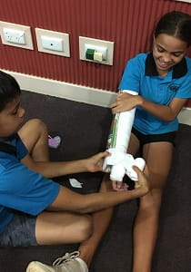Baler Primary students practise bandaging each other's limbs