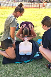 lifeguards practising CPR during training course