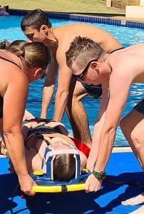 Hedland lifeguards practising a spinal rescue