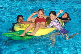 Hedland children on a pool inflatable pineapple