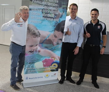 Laurie Lawrence, Royal Life Saving's Trent Hotchkin and Bayswater Waves staff member promoting Infant Aquatics