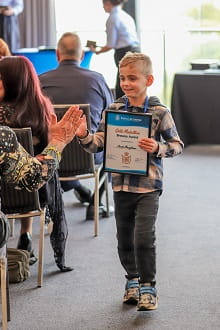 Jacob Maughmer carrying his Bravery Award