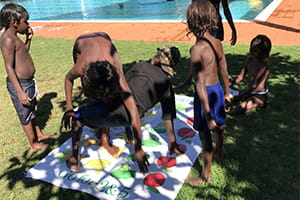 Jigalong children playing game of healthy twister