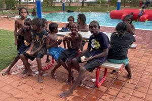 Aboriginal children enjoying  a party at Jigalong Pool