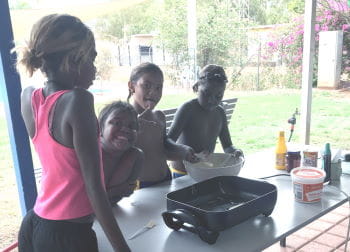 Aboriginal children waiting to cook pancakes at Jigalong pool