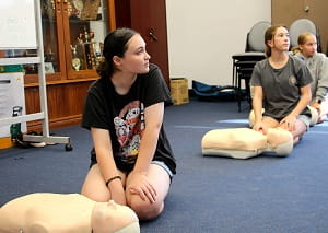 high school students learning CPR at a bronze medallion course