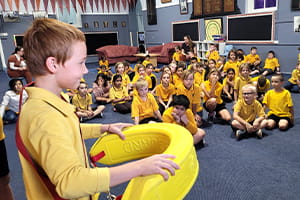 Boulder Primary School student holding a rescue tube
