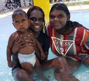 Two Kalumburu women with a baby in the pool