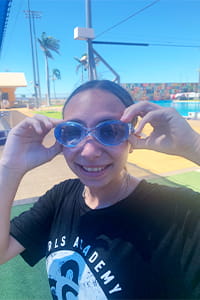 A girl wearing blue goggles