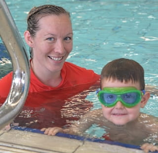 Swim instructor Joanne Jolly with five year old Jax Fletcher-George in the pool at Kwinana Recquatic