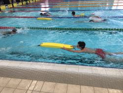 kid swimming in lane
