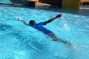 child swimming at the Leonora swimming pool