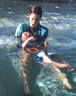Levi with his swim instructor in the water at Terry Tyzack