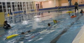 Lake Joondalup Baptist students swimming with rescue tubes at Joondalup Arena