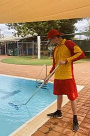 lifeguard cleaning pool