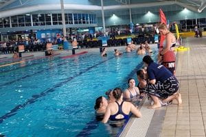 Ludita McLean and Sallie Watson working with a group of trainees in the pool at Bunbury