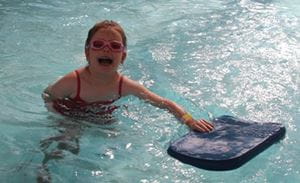 a young girl in the water enjoying her Swim and Survive lesson at Bold Park