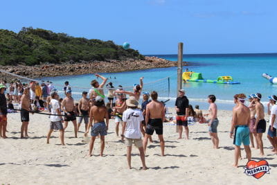 Leavers playing volleyball on the beach as part of Meelup Beach Day