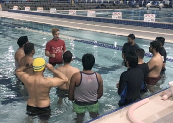 Multicultural men in the pool with their instructor at Cannington Leisureplex