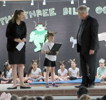 Keep Watch Coordinator Rachel Murray and Bateman Primary Principal Marc Lockett on stage with Mill receiving her award at the school assembley