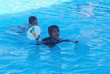 Aboriginal boy in the pool at Mt Magnet