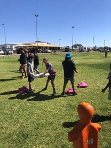 boy practising throwing a lifering at the Murchison Careers Expo