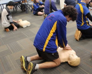 Students practising CPR skills