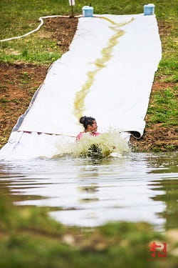 woman on water slide obstacle at Momentum 2021