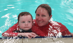 Brodie with his swim instructor in the pool at Kwinana